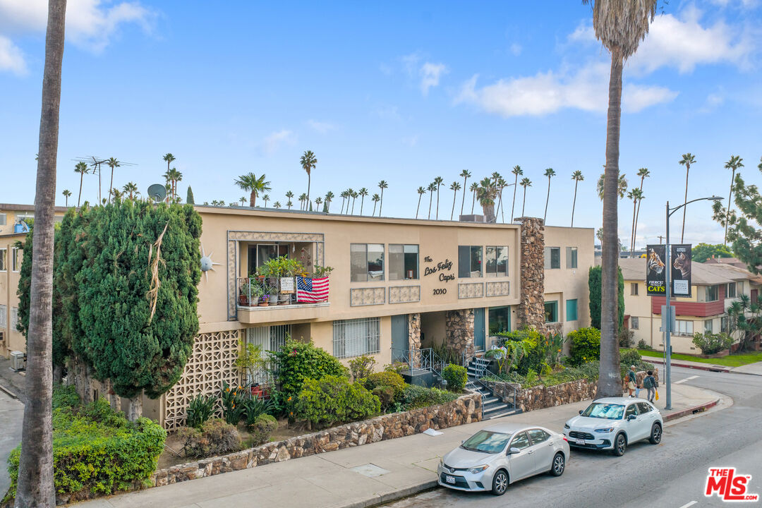 2030 North Vermont Avenue, Unit 6 Los Angeles, CA 90027 - Photo 24 of 25 a front view of a building with cars parked