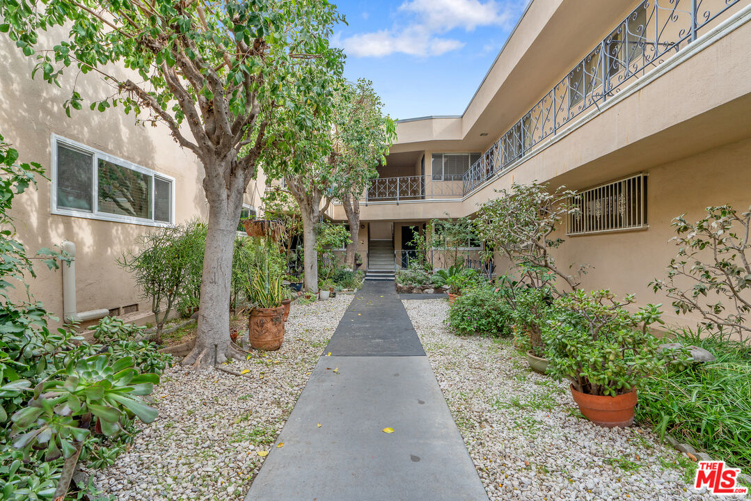 2030 North Vermont Avenue, Unit 6 Los Angeles, CA 90027 - Photo 3 of 25 a view of a house with potted plants