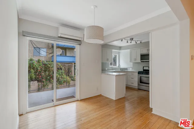 a view of livingroom and kitchen with hardwood floor