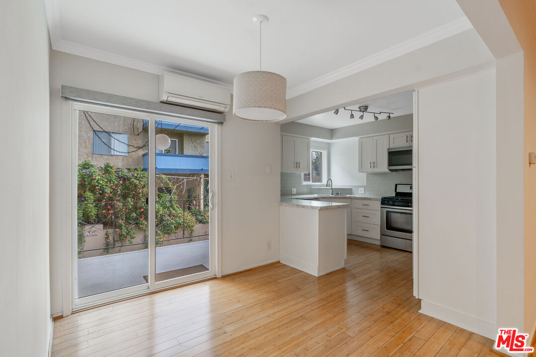 2030 North Vermont Avenue, Unit 6 Los Angeles, CA 90027 - Photo 10 of 25 a view of livingroom and kitchen with hardwood floor