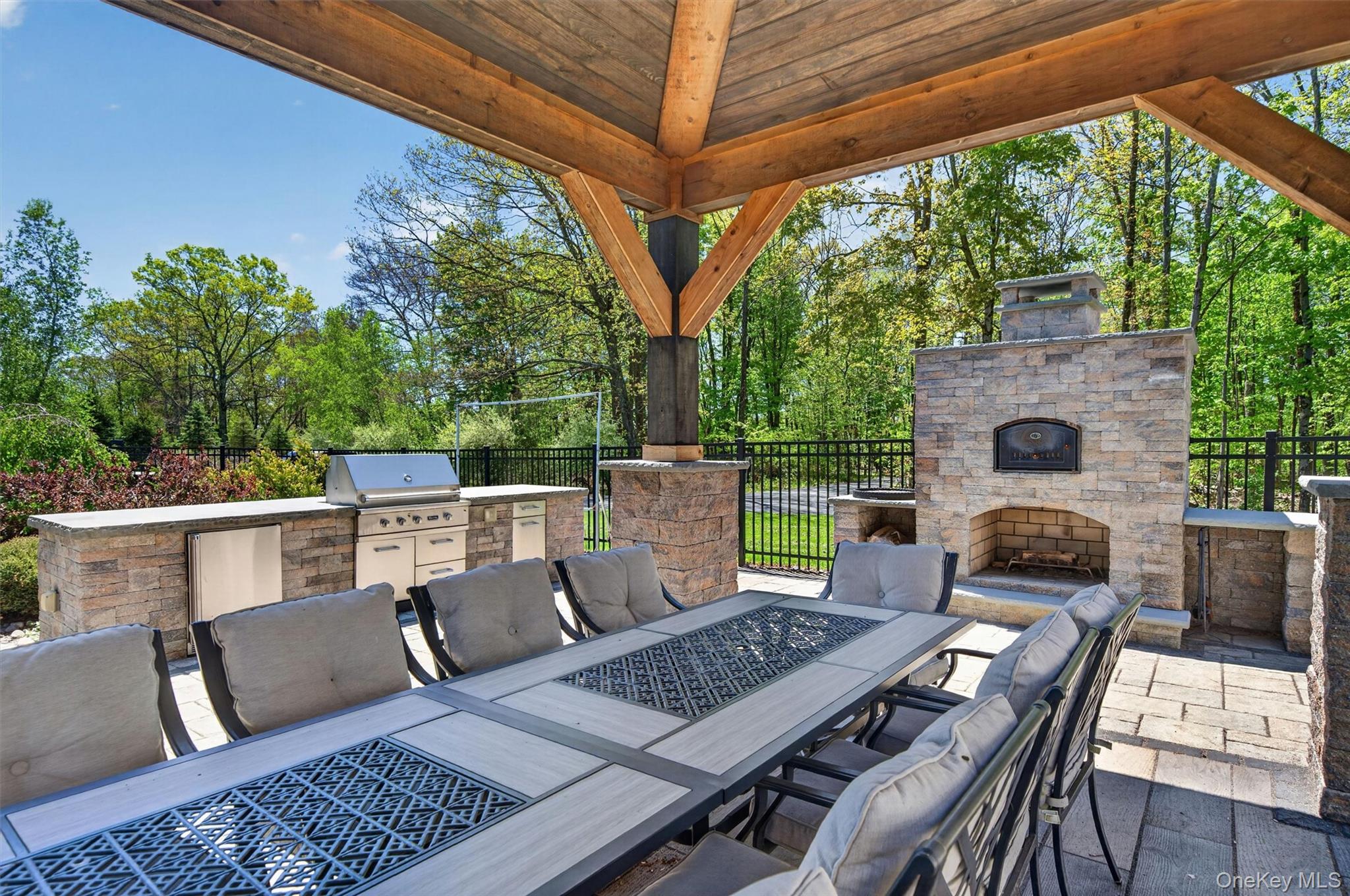 2 White Horse Road Middletown, NY 10940 - Photo 38 of 47 Elevate your outdoor dining experience under the shade of the pergola, complete with a professional-grade kitchen and a wood-fired brick oven for the ultimate pizza night.