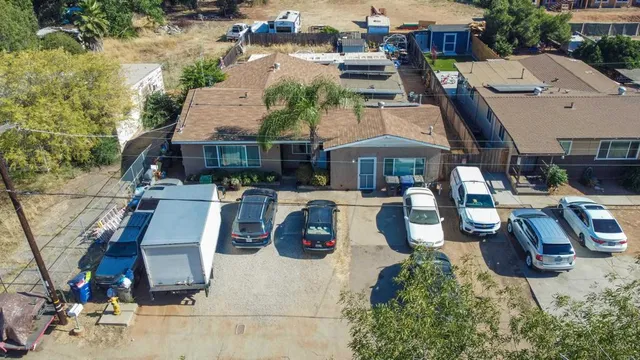 an aerial view of a house with garden and patio