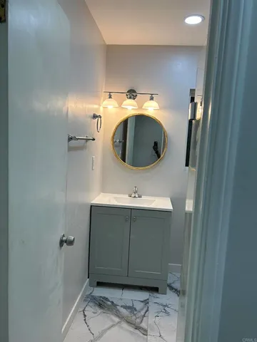 a bathroom with a sink and mirror
