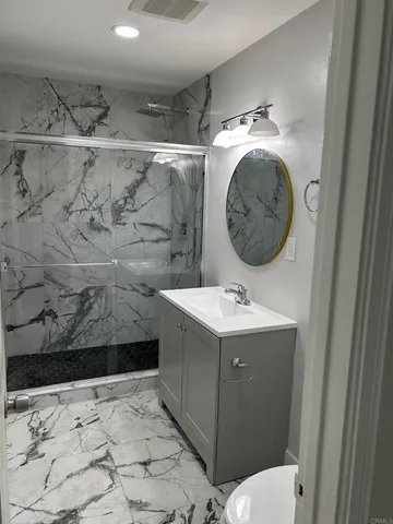 a bathroom with a sink and mirror