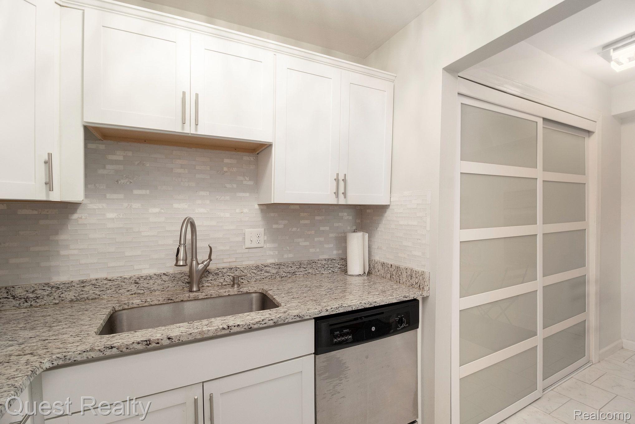 4905 Crooks Road, Unit B2 Royal Oak, MI 48073 - Photo 6 of 17 Newer kitchen cabinets, granite etc