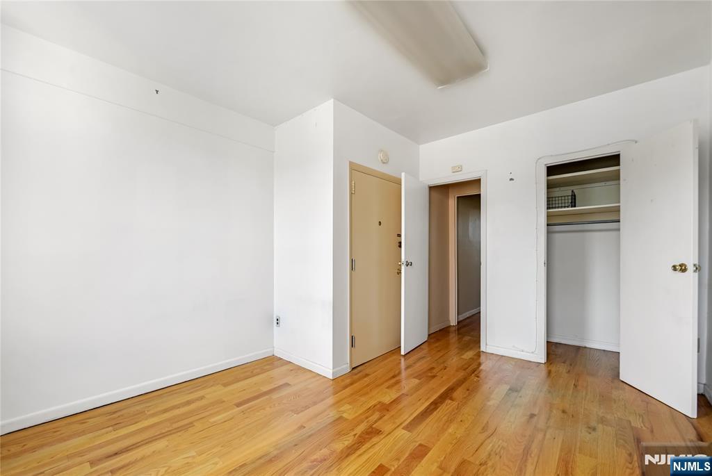 523 Adams Street, Unit 5 Hoboken, NJ 07030 - Photo 15 of 17 a view of an empty room with wooden floor