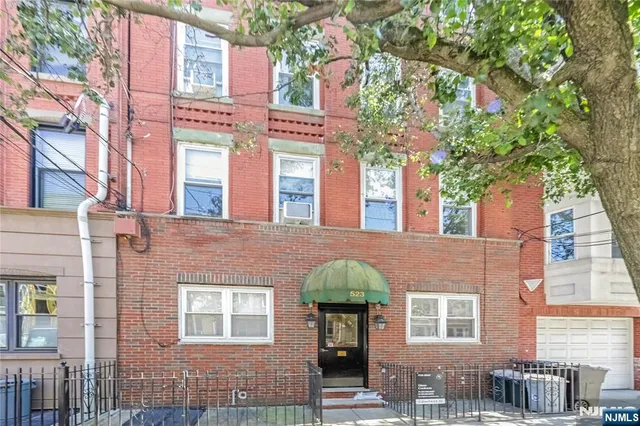 a front view of a multi story residential apartment buildings
