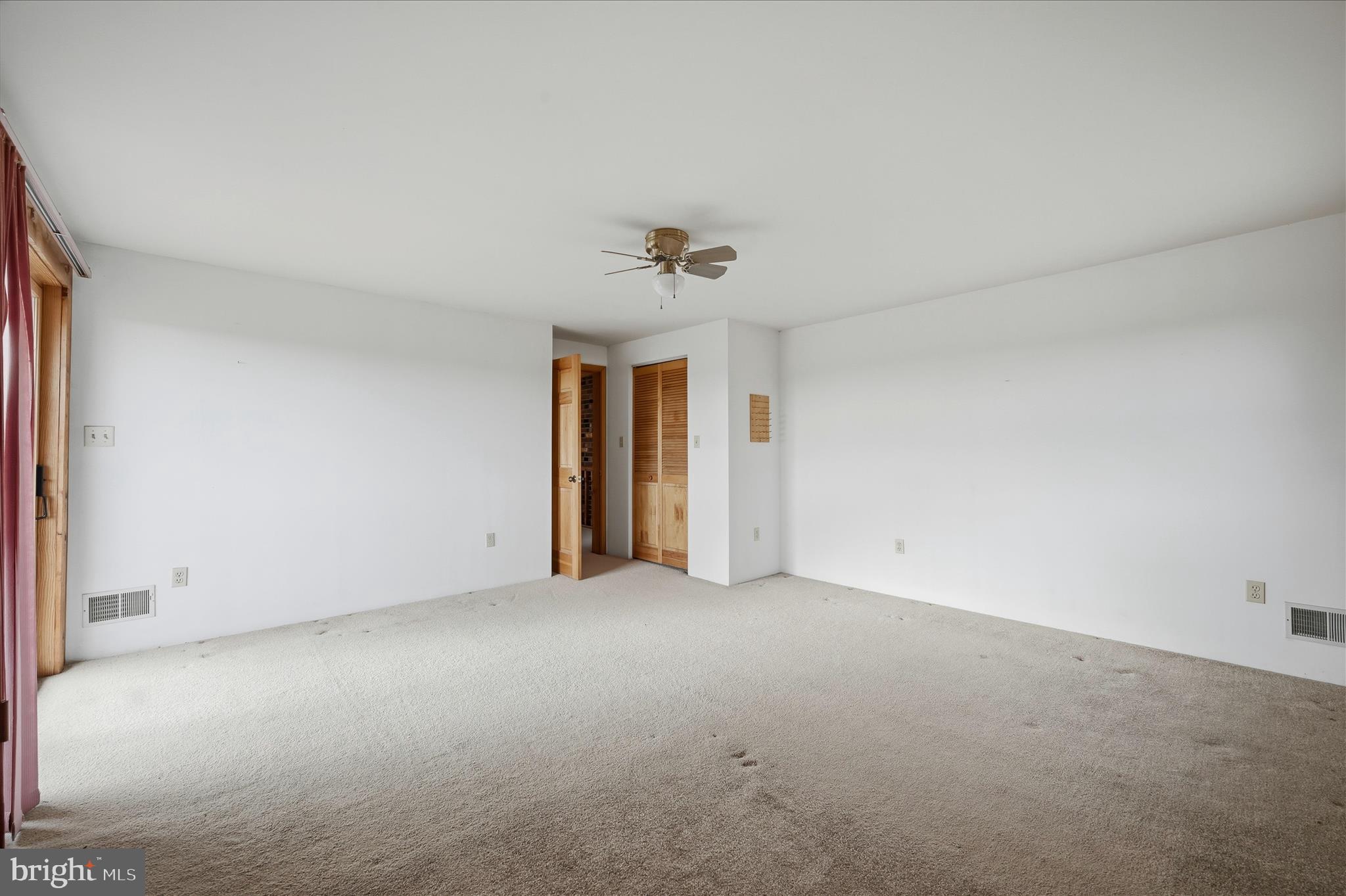 2048 Co Rte 1/11 Kearneysville, WV 25430 - Photo 39 of 95 an empty room with a window and a ceiling fan
