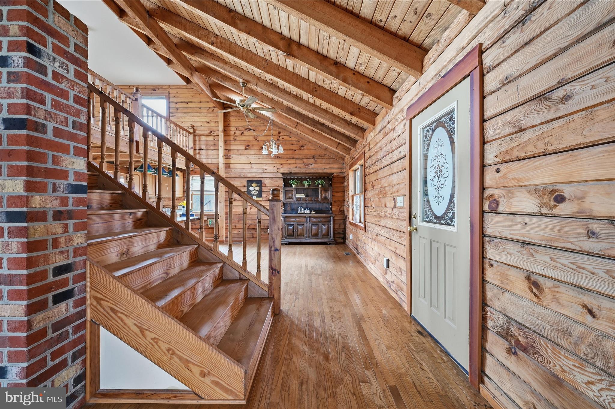 2048 Co Rte 1/11 Kearneysville, WV 25430 - Photo 5 of 95 a view of a hallway with wooden floor and staircase