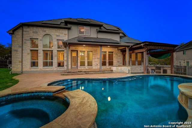 245 Monarch Lane Austin, TX 78737 - Photo 1 of 1 a front view of a house with swimming pool and porch