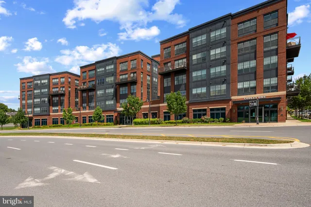 a view of a building with a street