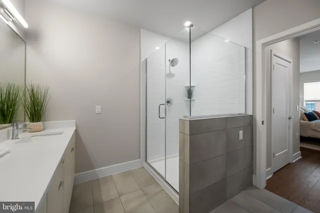 a bathroom with a shower and a sink