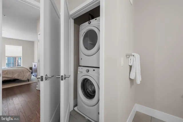 a utility room with sink dryer and washer