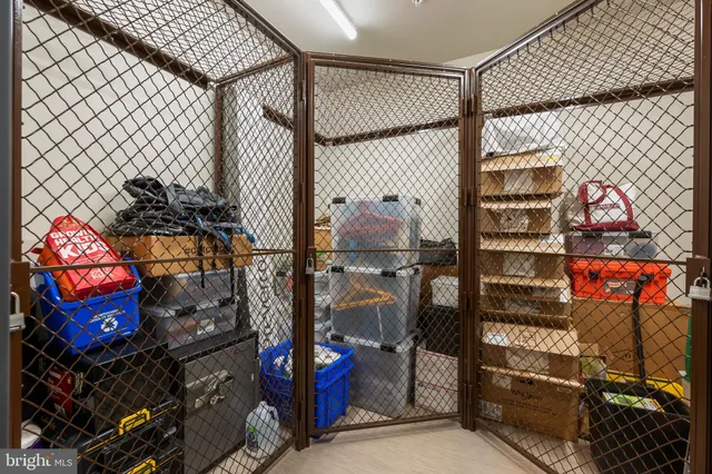 an open kitchen with dining table and stainless steel appliances