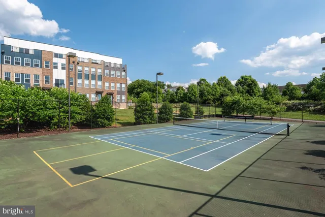 a view of a building with car parked