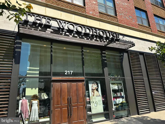 a view of water with boats and trees in the background