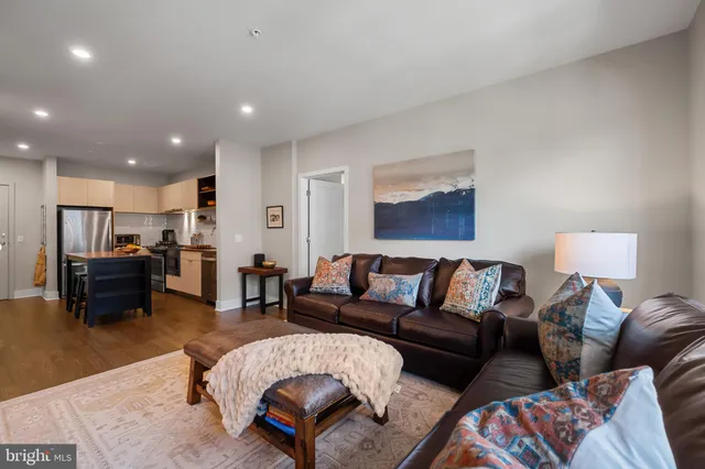 a living room with furniture and a table