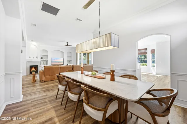 a bathroom with a granite countertop sink a mirror a vanity and a shower