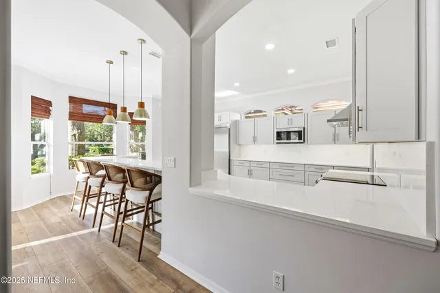 a bedroom with a large bed and a large window