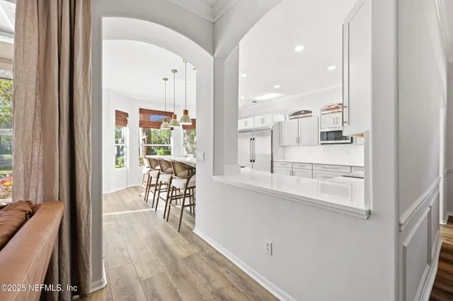 a spacious bathroom with a shower sink mirror and a bathtub