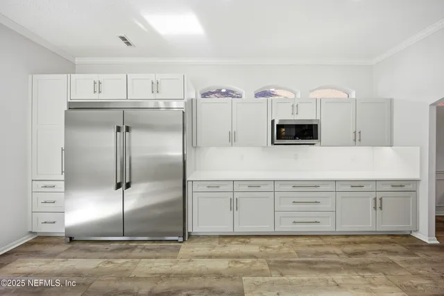 a bathroom with a shower and a mirror