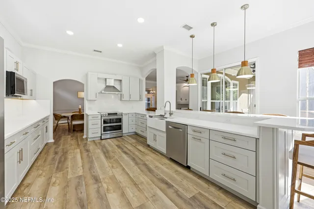 a backyard of a house with yard and outdoor seating