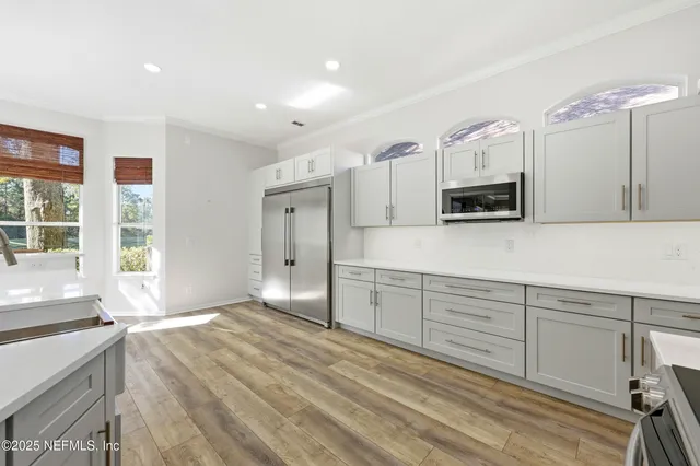 a view of outdoor space with deck and trees