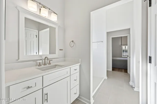 a front view of a house with yard and green space