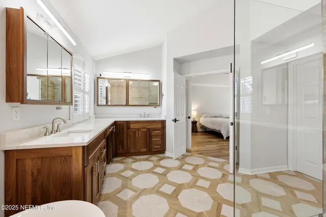 an aerial view of residential houses with outdoor space and street view