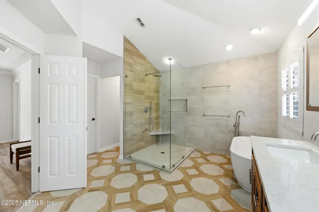 a view of a patio with couches and a table and chairs with potted plants