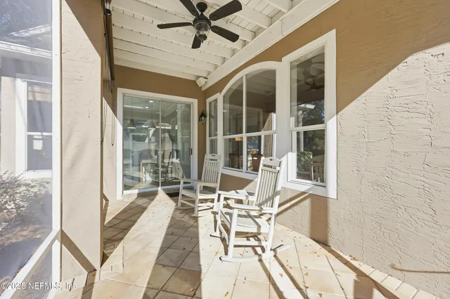 an aerial view of a house with a yard basket ball court and outdoor seating