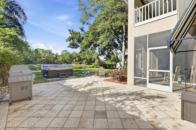 a view of a swimming pool with a patio