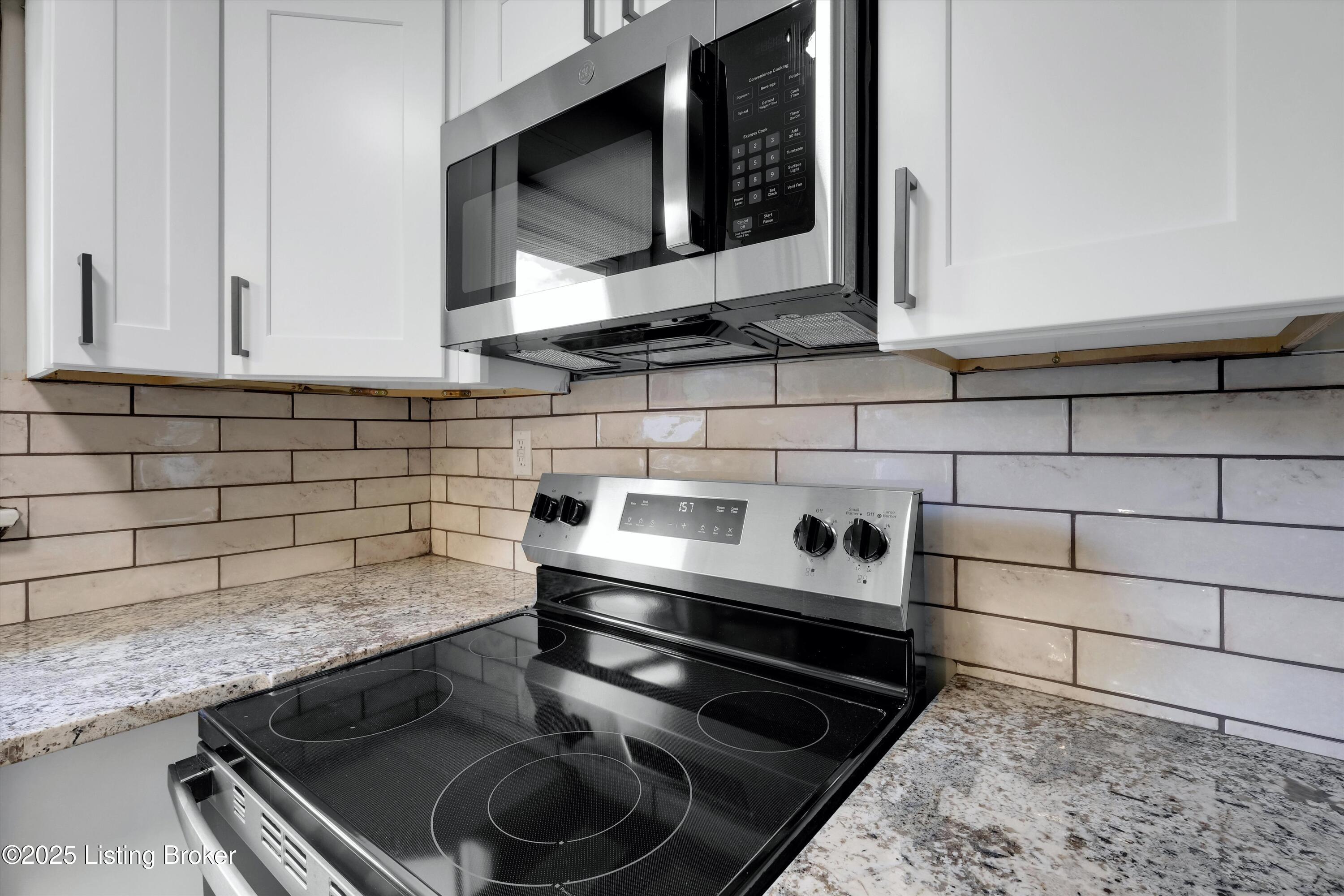 6509 Delton Road Louisville, KY 40258 - Photo 13 of 35 Stainless steel stove and microwave