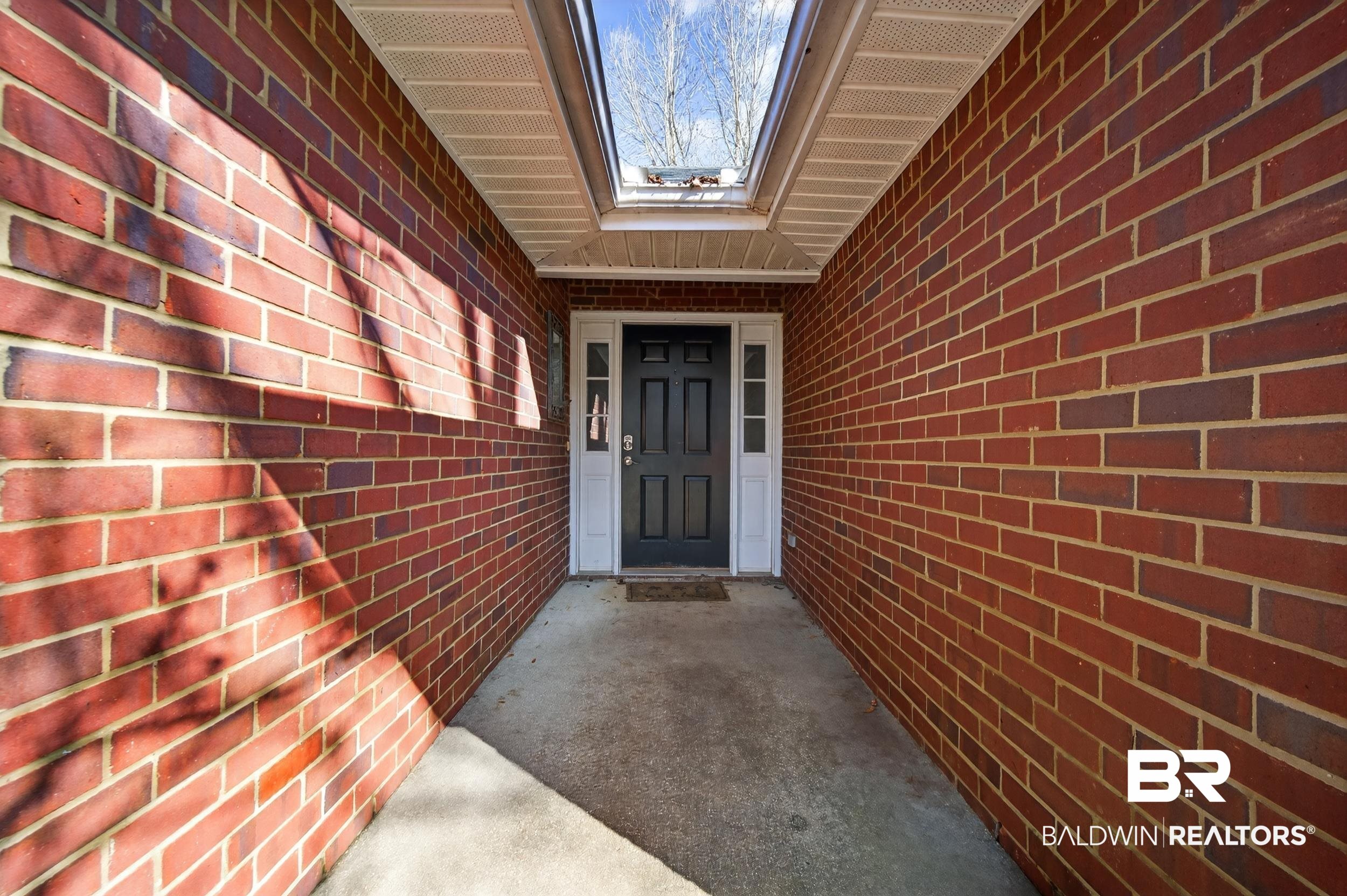 108 Davison Loop Fairhope, AL 36532 - Photo 2 of 17 View of exterior entry with brick siding