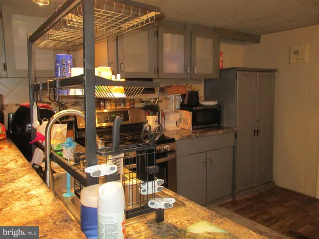 a kitchen with refrigerator and cabinets