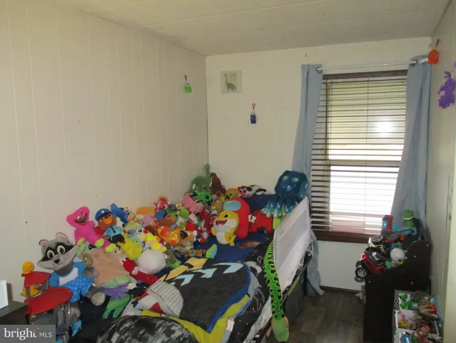 a bedroom with a bed and a closet