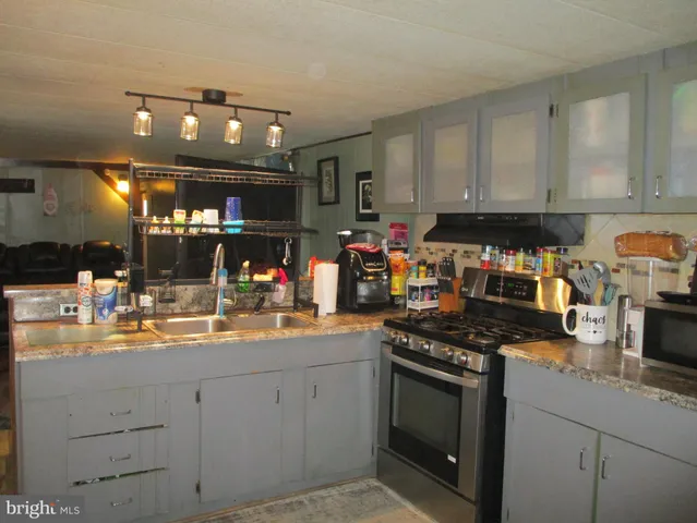 a kitchen with a sink and cabinets
