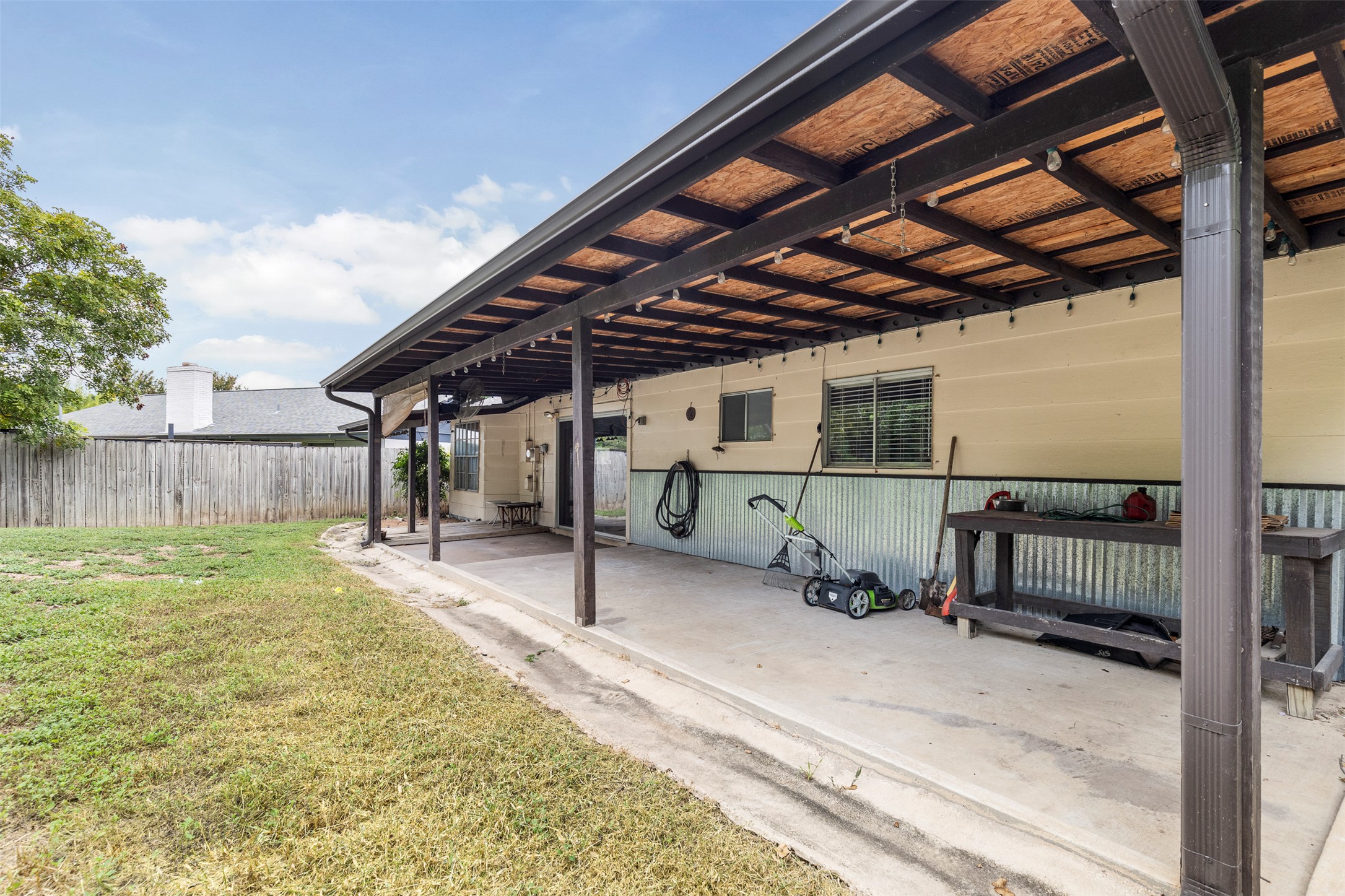 7506 Glenhill Road Austin, TX 78752 - Photo 21 of 24 A covered patio provides an ideal setting for outdoor activities and relaxation.