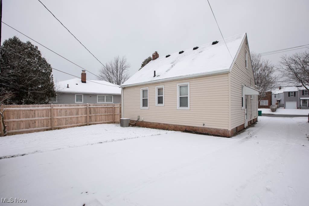 19310 Libby Road Maple Heights, OH 44137 - Photo 17 of 20 Snow covered property with central air condition unit