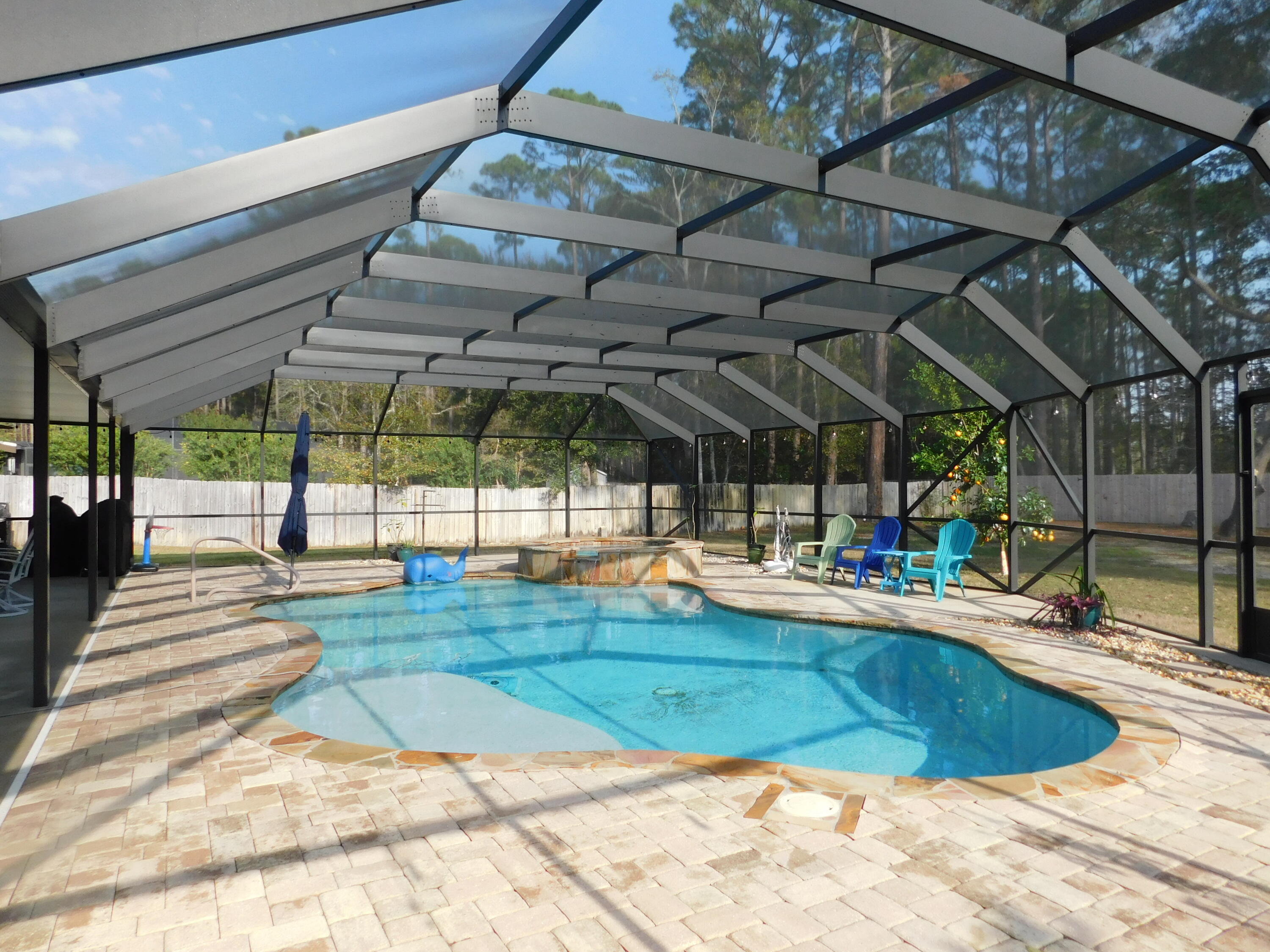482 Driftwood Point Road Santa Rosa Beach, FL 32459 - Photo 1 of 40 a view of a swimming pool with a patio