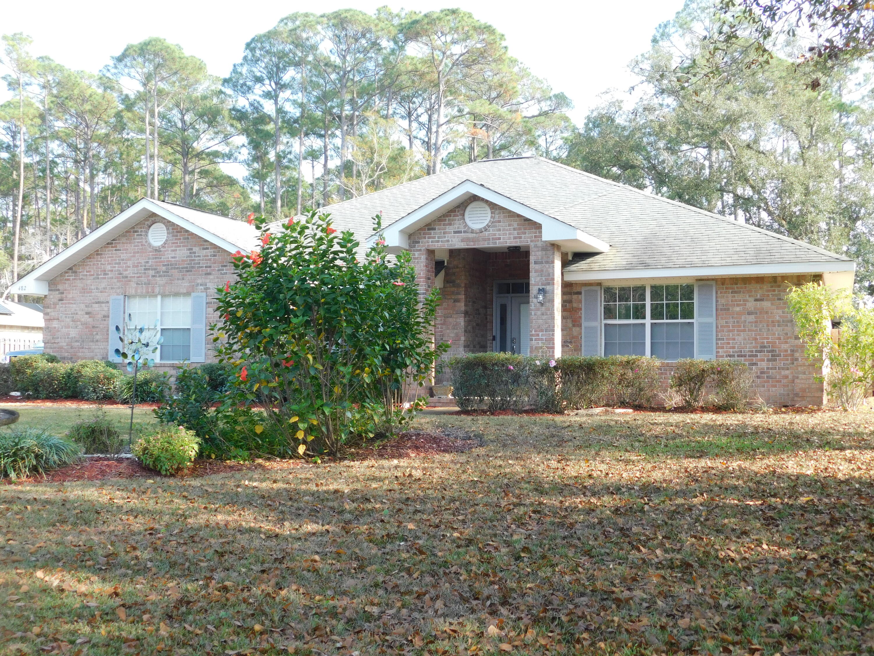482 Driftwood Point Road Santa Rosa Beach, FL 32459 - Photo 8 of 40 a front view of a house with a yard