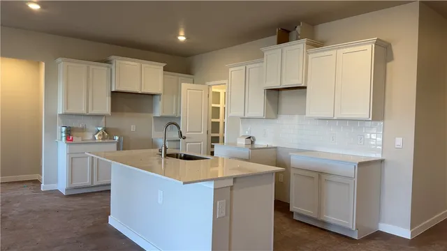 a view of a room with a sink and window