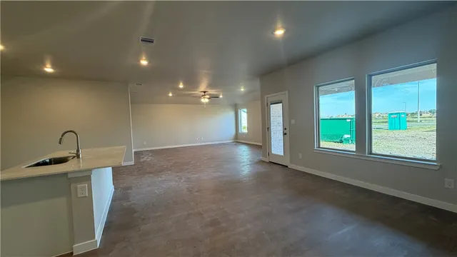 a bathroom with a sink and a window
