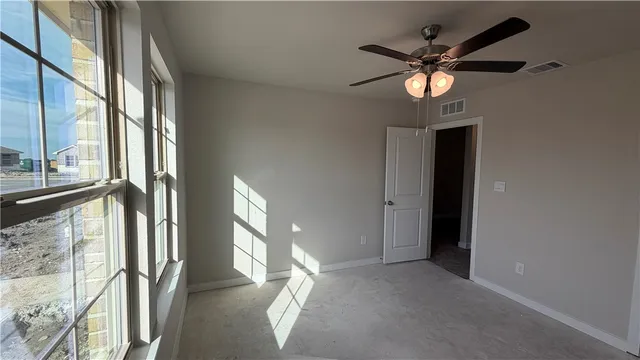 a view of a hallway with a chandelier