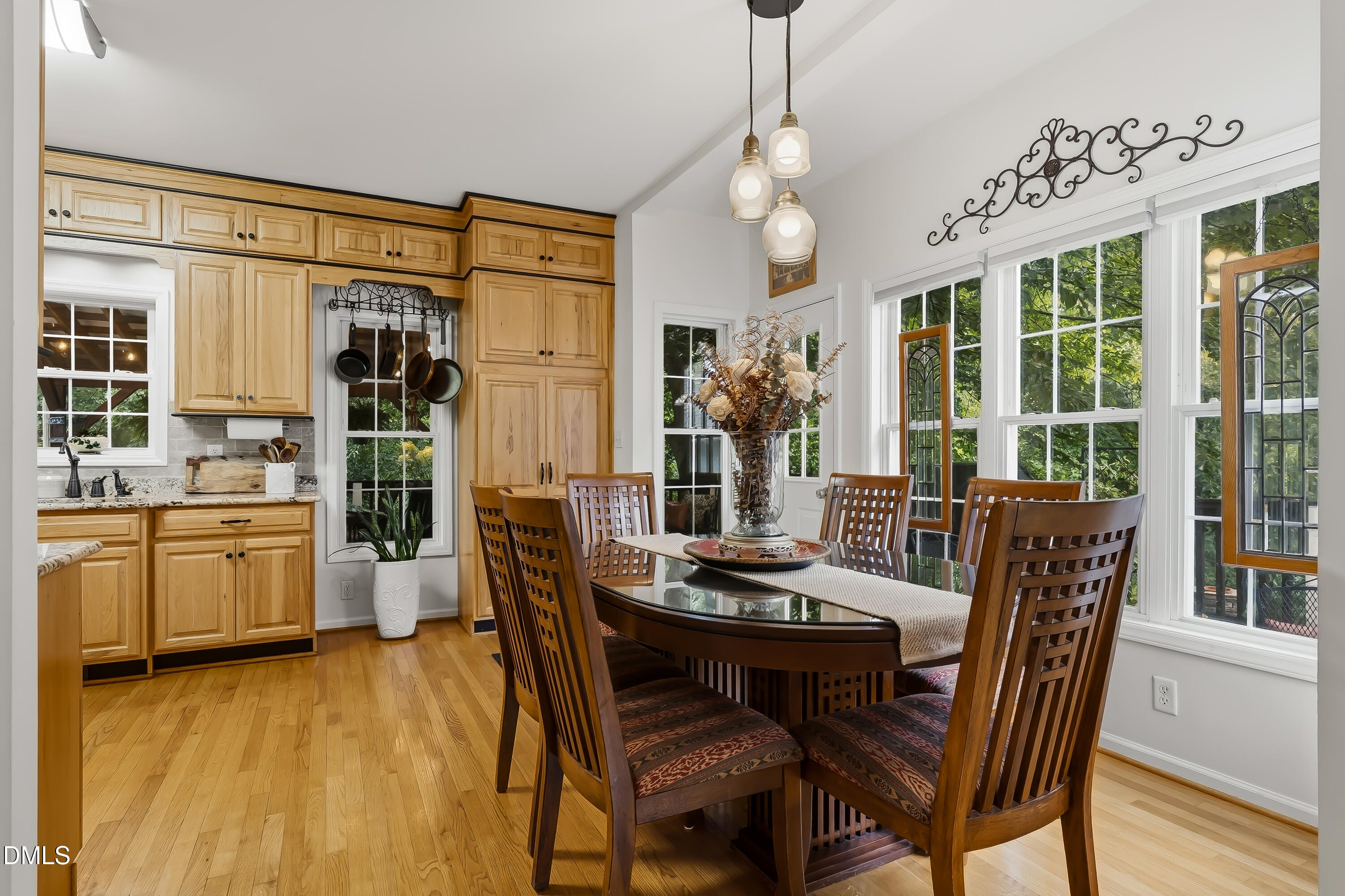 1214 Halcyon Place Rougemont, NC 27572 - Photo 18 of 69 a dining room with furniture a chandelier and wooden floor