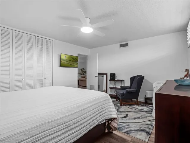 a spacious bathroom with a double vanity sink toilet and shower