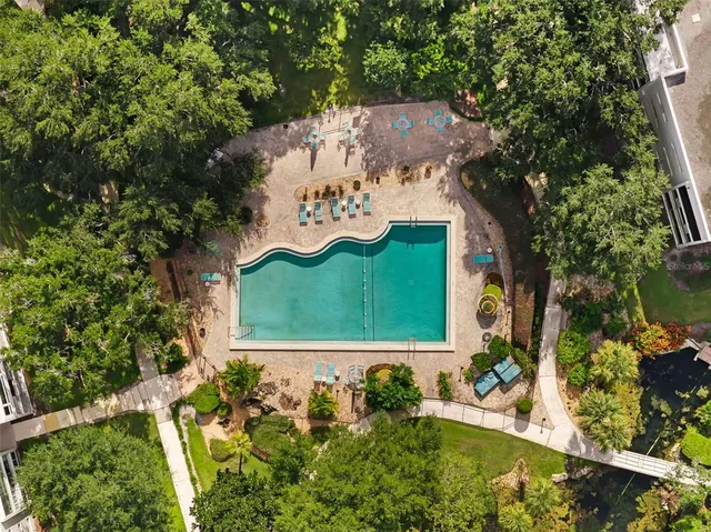 a view of a swimming pool with a yard