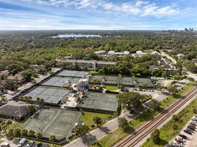 a view of a park with large trees