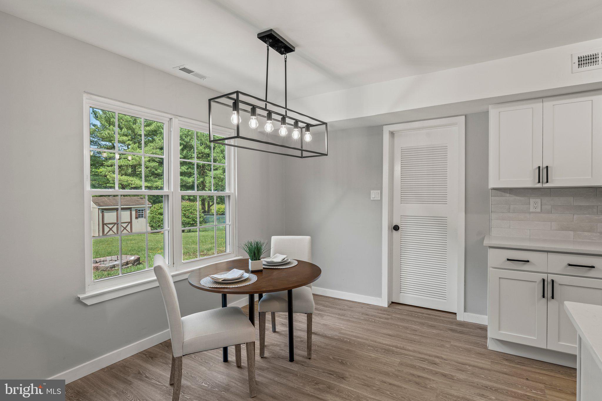 71 Borrelly Boulevard Sewell, NJ 08080 - Photo 11 of 39 a view of a dining room with furniture window and wooden floor