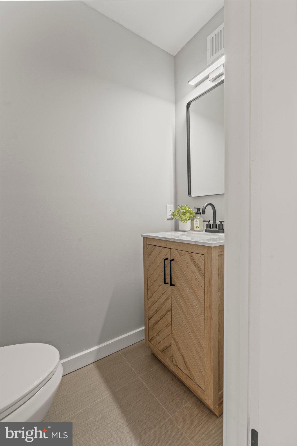71 Borrelly Boulevard Sewell, NJ 08080 - Photo 14 of 39 a bathroom with a sink toilet and mirror